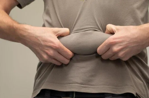 perut buncit, kebiasaan buruk, pola makan sehat, olahraga teratur, buah dan sayur, stres tinggi, kurang tidur, minuman manis, gorengan dan kalori, pencernaan lancar, lemak perut, BAB rutin, metabolisme tubuh