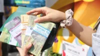 ukar uang, penukaran uang baru, Bank Indonesia, PINTAR BI, Lebaran 2025, uang baru, layanan BI, kas keliling, penukaran online