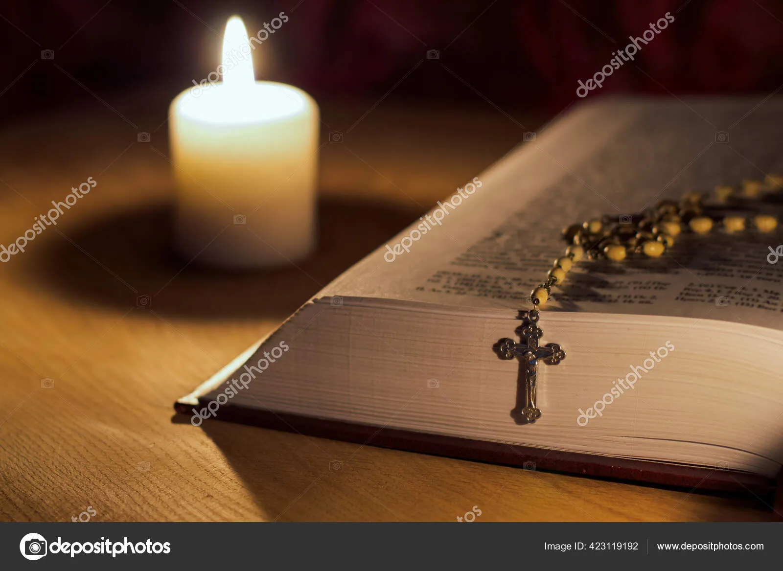 A burning candle, a bible and a cross a rosary on a wooden table bacaan, ekaristi, Harian, homili, injil, Katolik, misa, Perayaan, renungan
